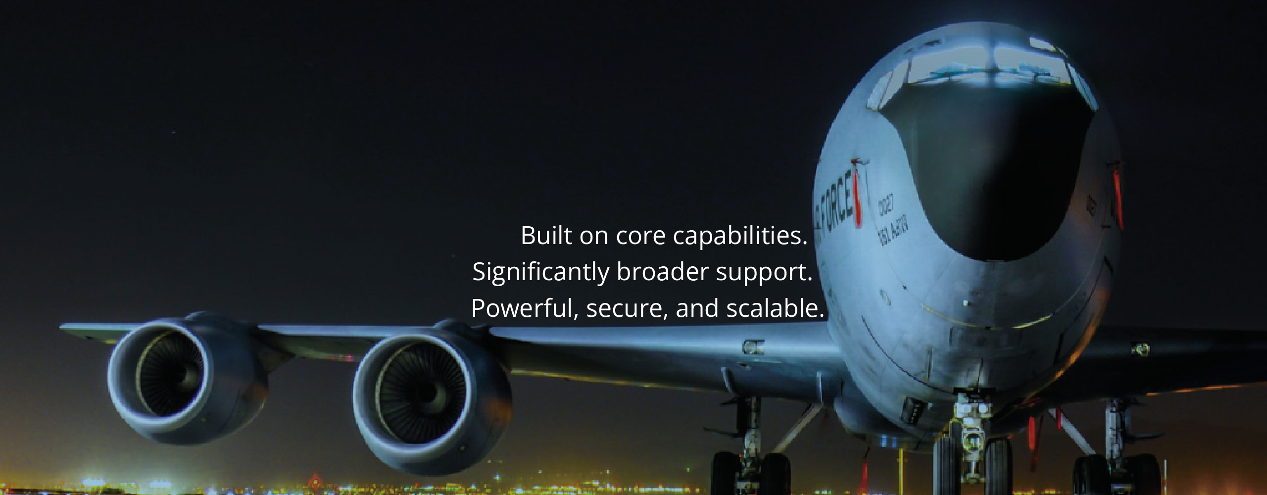 air force one on runway at night with overlay of text saying 'Built on core capabilities. Significantly broader support. Powerful, secure, and scalable.'