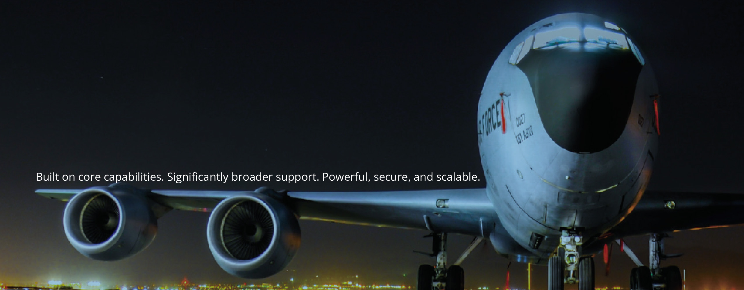 air force one on runway at night with overlay of text saying 'Built on core capabilities. Significantly broader support. Powerful, secure, and scalable.'